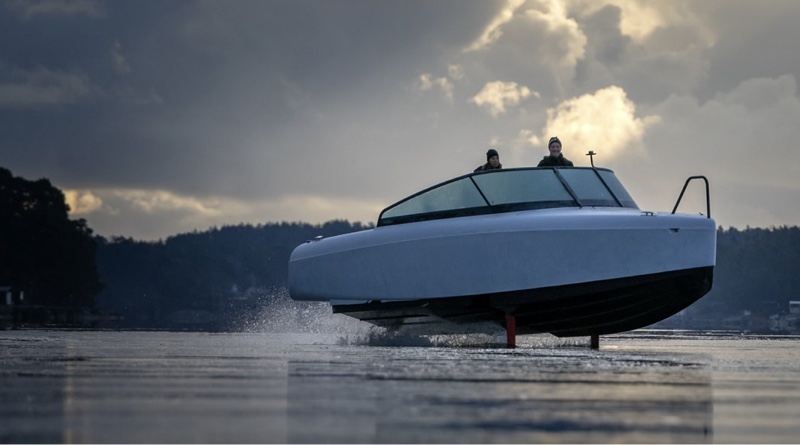 Candela e-boats travelling on hydrofoils at dusk