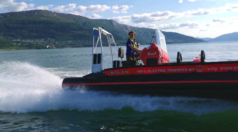 A man driving a 8.5 meter - 28 foot boat with an electric motor