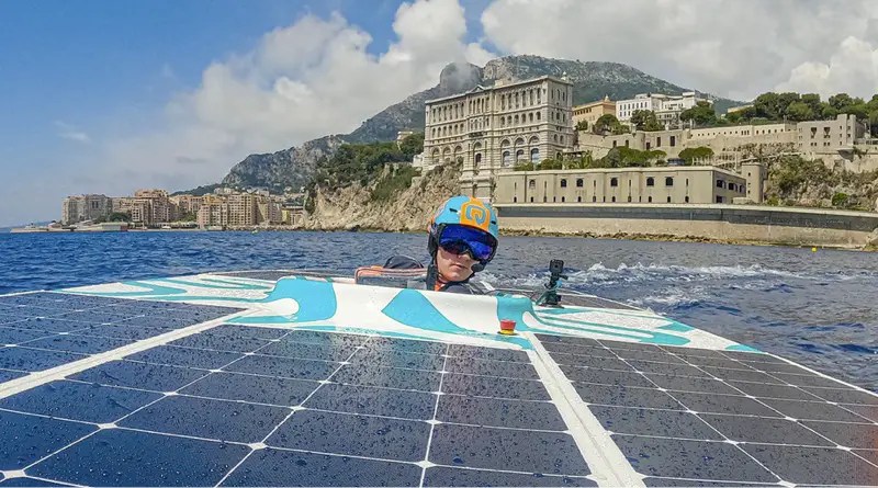 Monaco Energy Boat Challenge competitor pilots his boat with Monaco in the backgroun