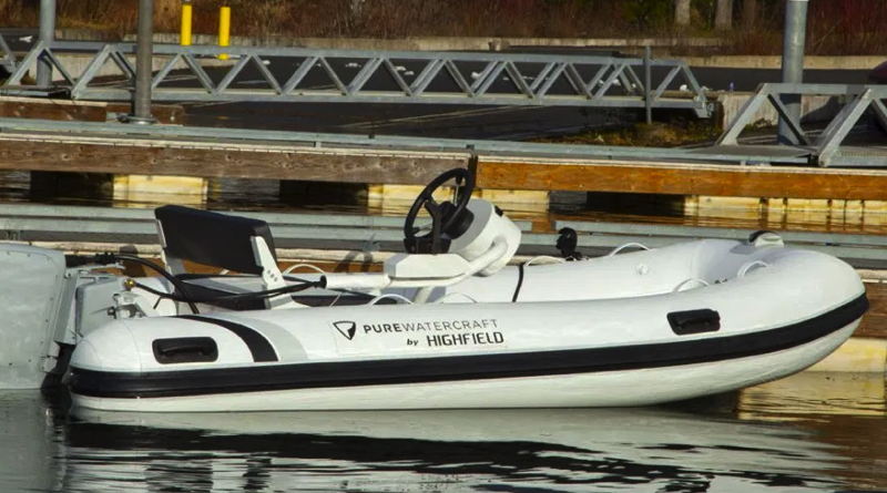 new electric boat package of a Highland RIB with a Pure Watercraft outboard sitting at a dock