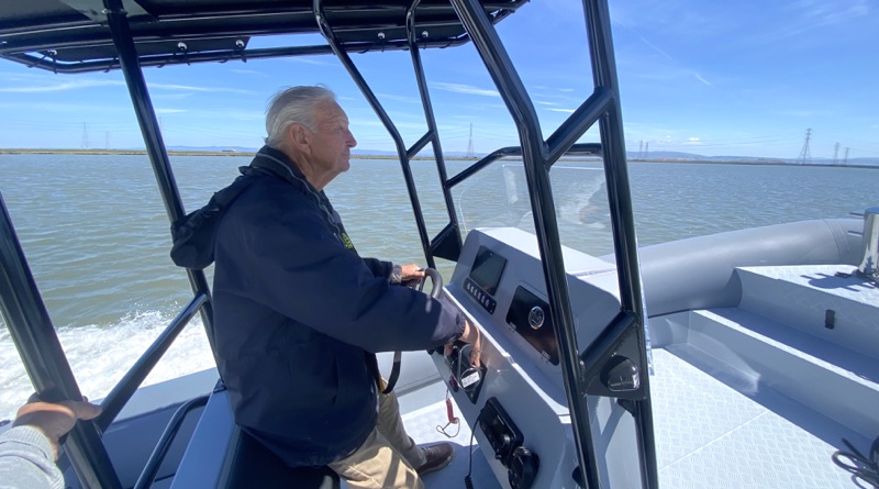 Vita electric workboat being captained by Westpoint President Mark Sanders
